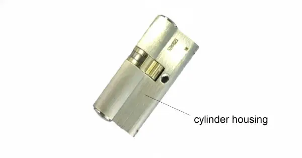 Cylinder housing with two cylinder cores, locking bar and coupling visible in the recess